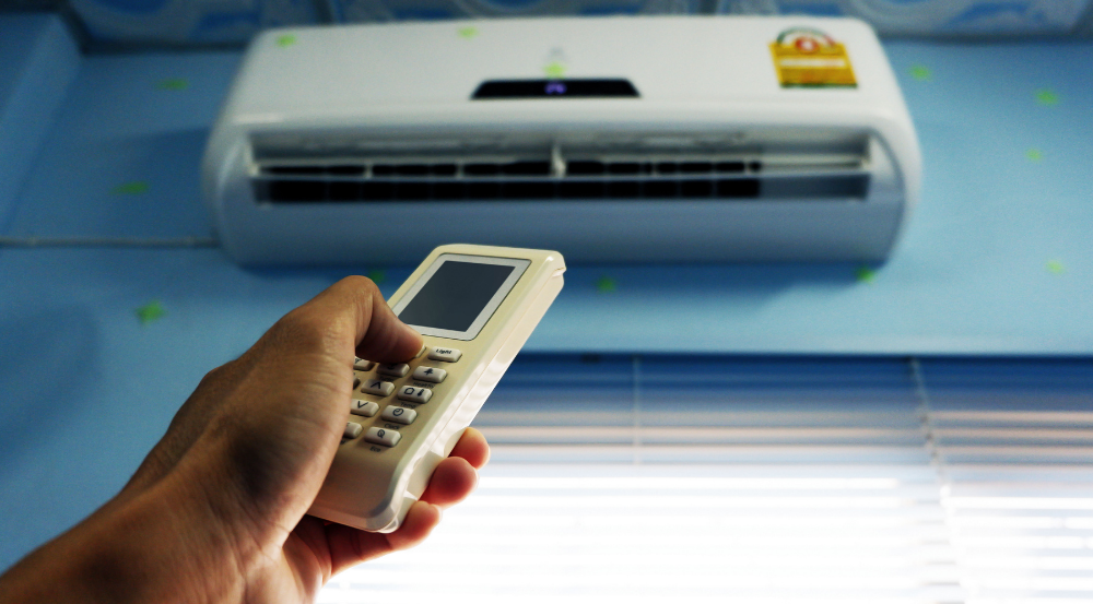 ampala City Coolers technician performing deep cleaning of AC filters to improve indoor air quality in a Kampala office