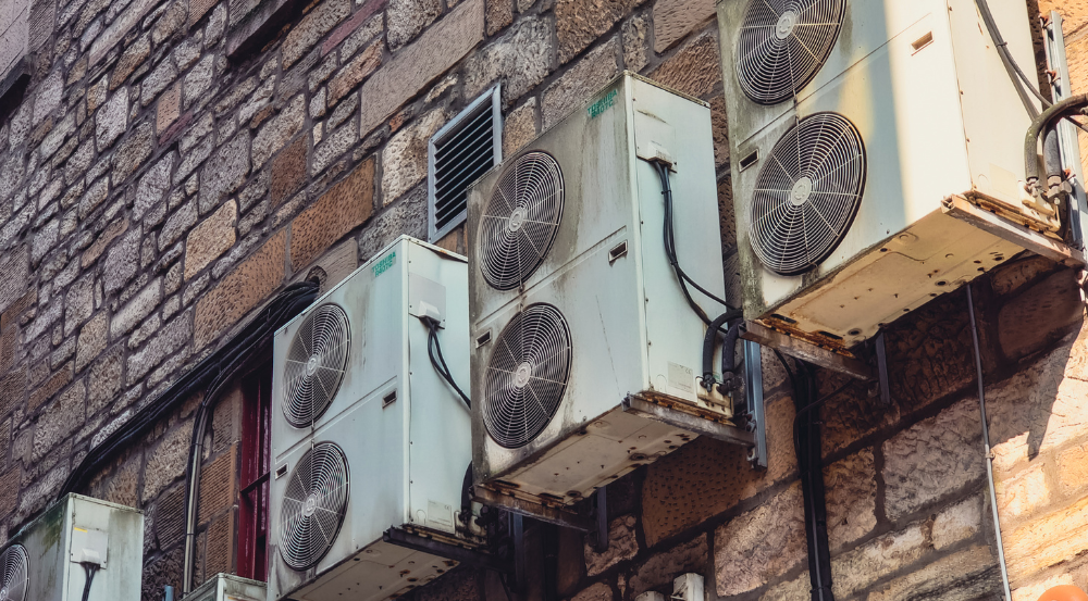 Close-up of a well-maintained air conditioning unit showing clean evaporator coils and a clear drainage system